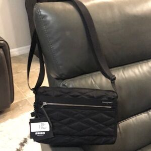 Black Messenger Bag with Adjustable Strap and Quilted Design